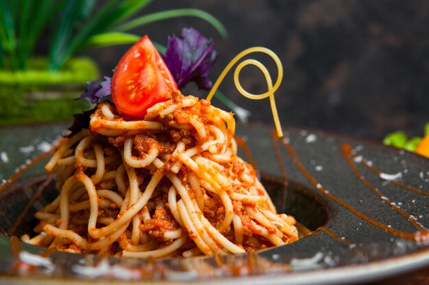 Close-up pasta with tomato sauce on wooden table