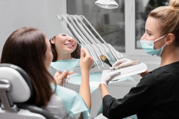 Free photo close up patient and dentist at clinic