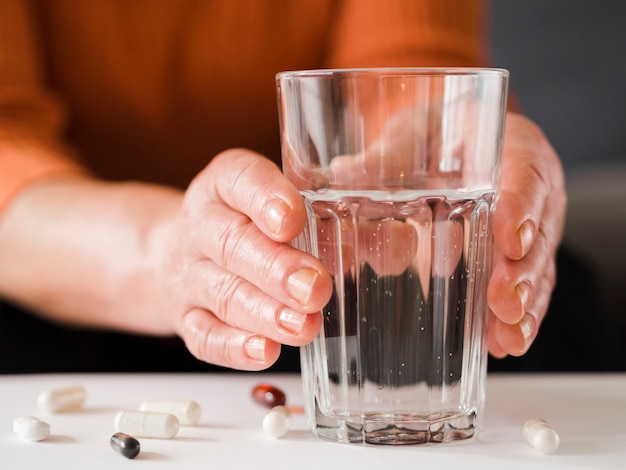 Free Photo close-up patient holding glass