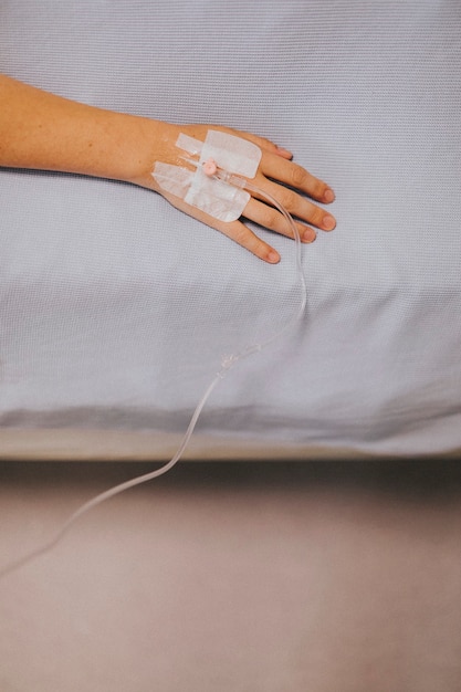 Free photo close up of a patients hand with an iv