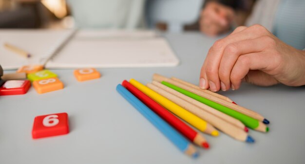 Close-up of pencils on table during tutoring session at home