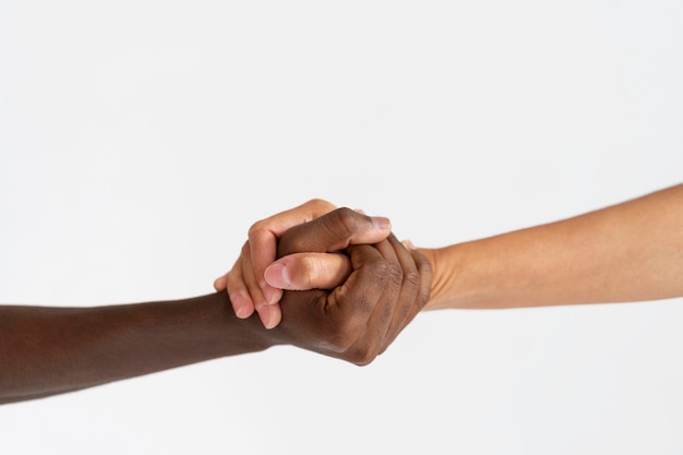 Close up on people connecting through hands