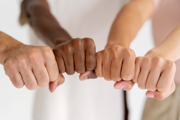 Free photo close up on people connecting through hands