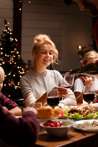 Close up on people enjoying christmas dinner