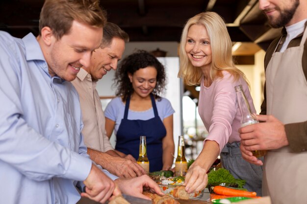 Close up people gathering with food