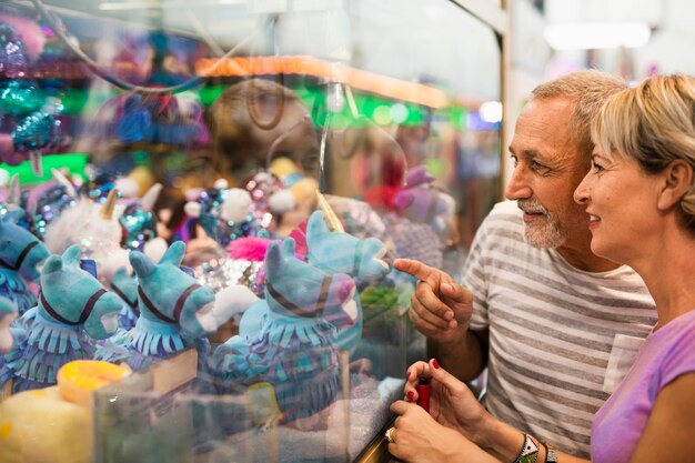 Close-up people looking at toys