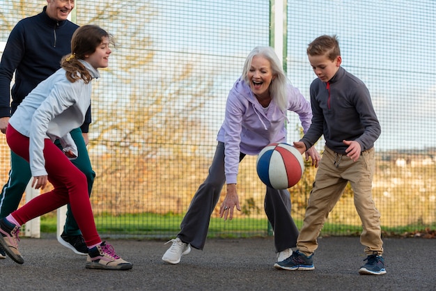 Free photo close up people playing basketball