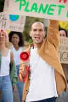 Free photo close up people protesting together