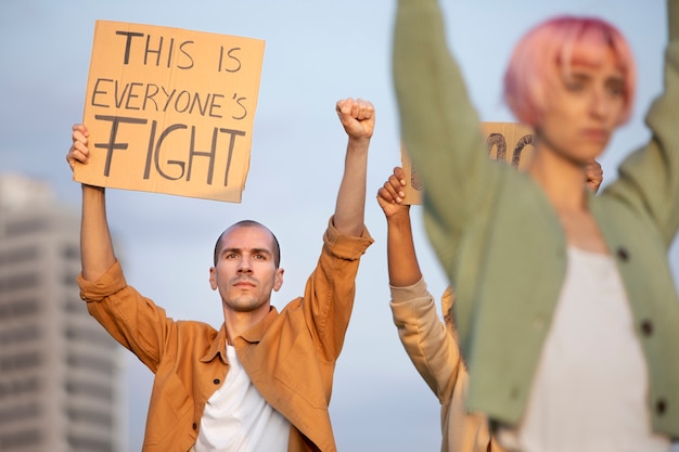 Free photo close up people protesting together