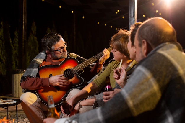 Close up people with guitar music