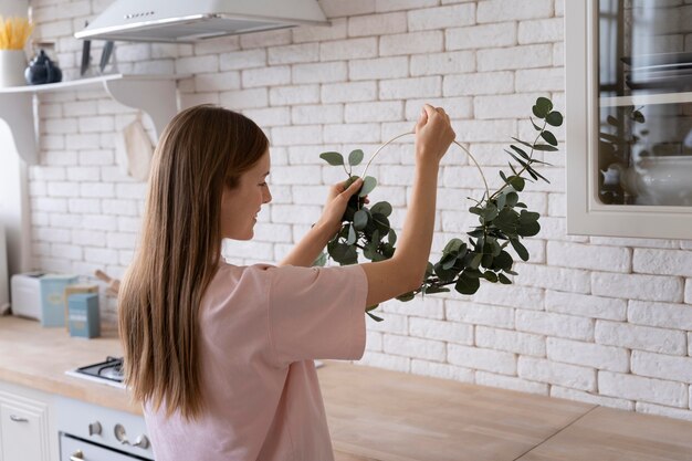 Free Photo close up on person making home comfortable