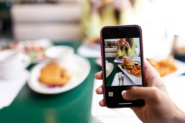 Close up on person taking photo of food