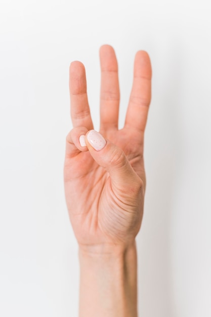 Close-up person teaching sign language