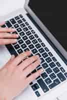 Free photo close-up of person typing on keyboard