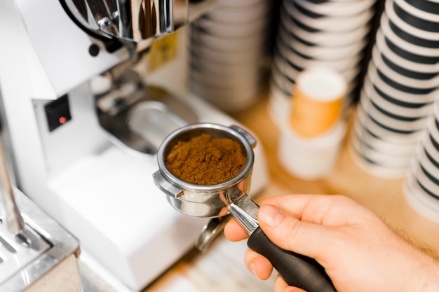 Close-up person with coffee machine