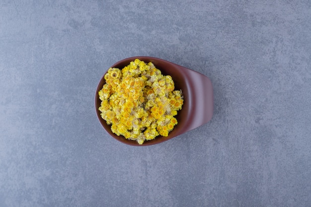 Close up photo of dry herbs in bowl