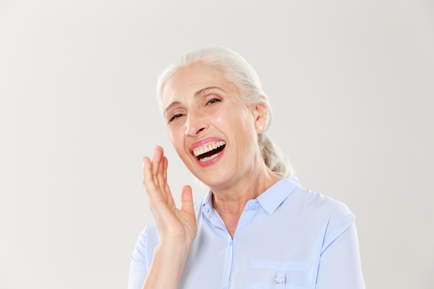 Close-up photo of laughing elderly woman