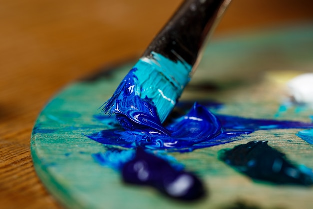 Free Photo close up photo of mixing oil paints on palette