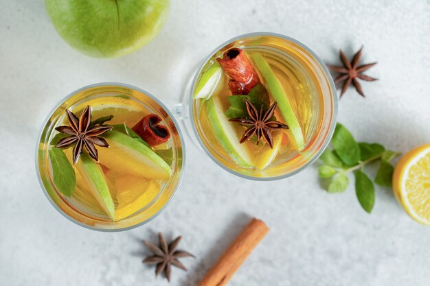 Close up photo. top view of two glass of apple cocktail. 