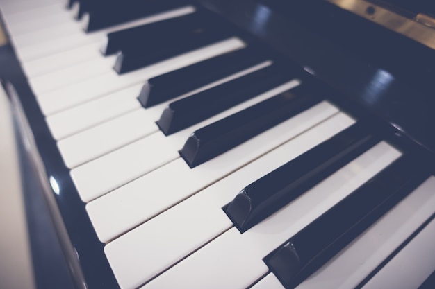 Free photo close up of piano keys with selective focus ,filtered image proc