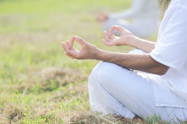 close up picture of hands doing meditation