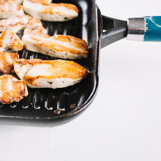 Close-up pieces of grilled chicken