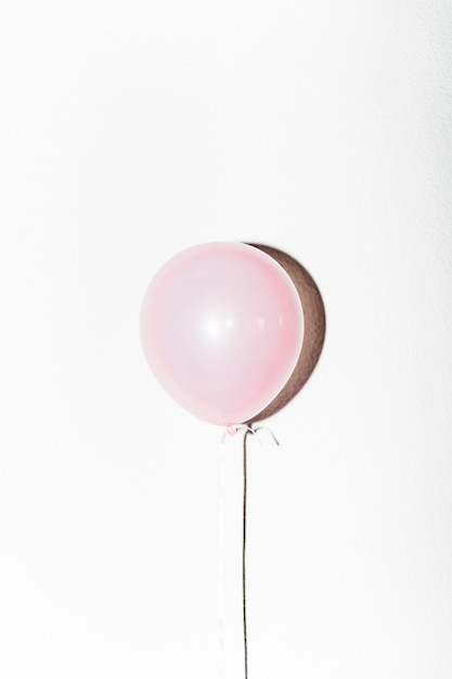 Free photo close-up of pink balloon with shadow isolated on white background