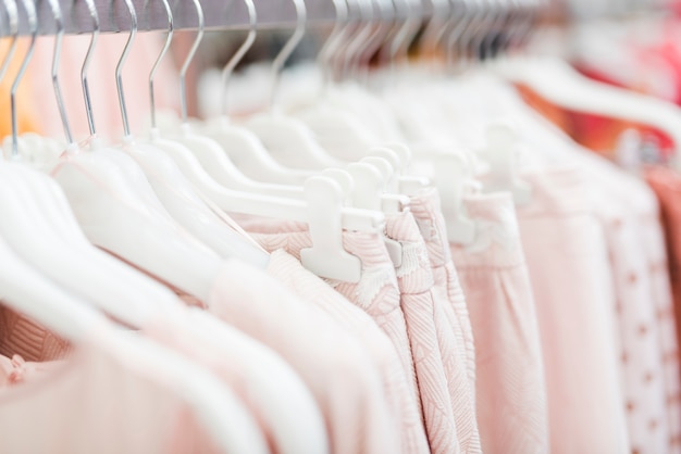 Close-up pink clothes on hangers