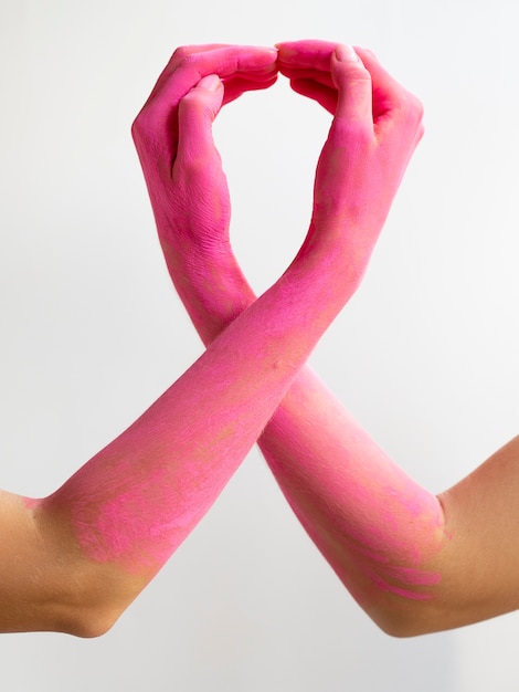 Free photo close-up pink painted arms expressing awareness