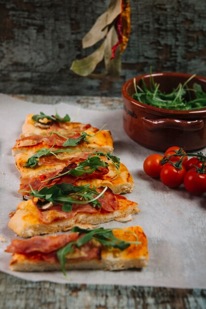 Close-up pizza near tomatoes