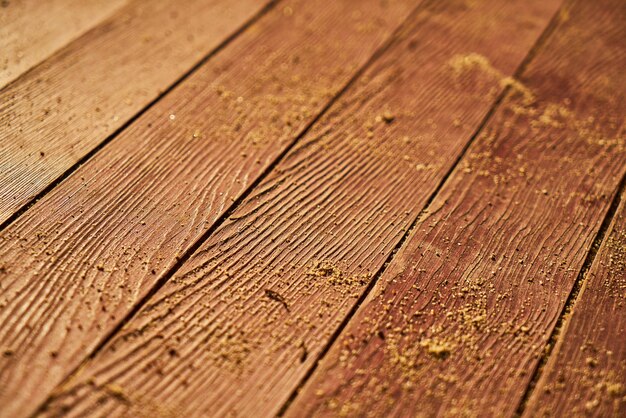 Close-up of planks with sand