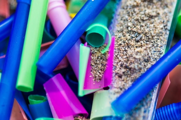 Close-up plastic pieces collected from sand