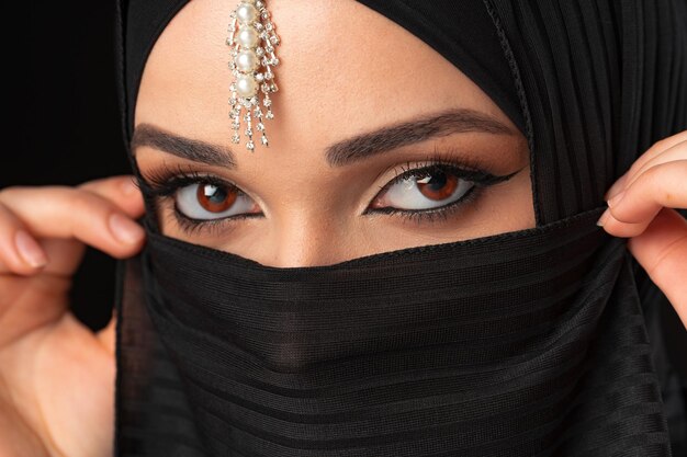 Close up portrait of beautiful muslim girl dressed in hijab