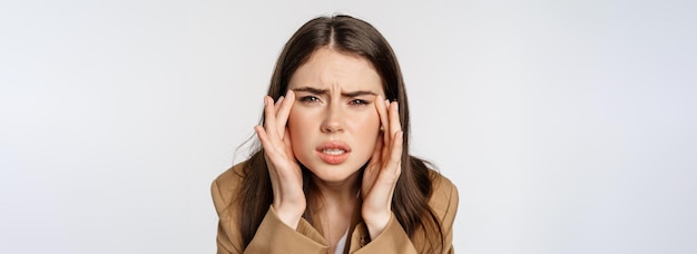 Close up portrait of business woman squinting and looking without glasses cant see bad sight without