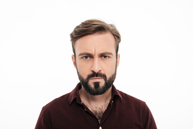 Close up portrait of frowning angry bearded man