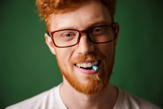 Close up portrait of a happy redhead man in eyeglasses