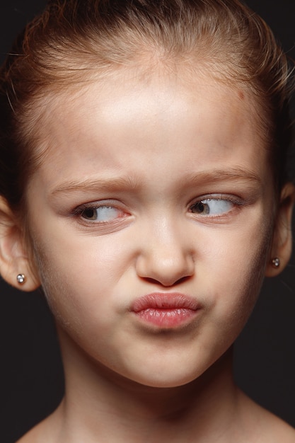 Free Photo close up portrait of little and emotional caucasian girl. highly detail photoshot of female model with well-kept skin and bright facial expression. concept of human emotions. disgusting.