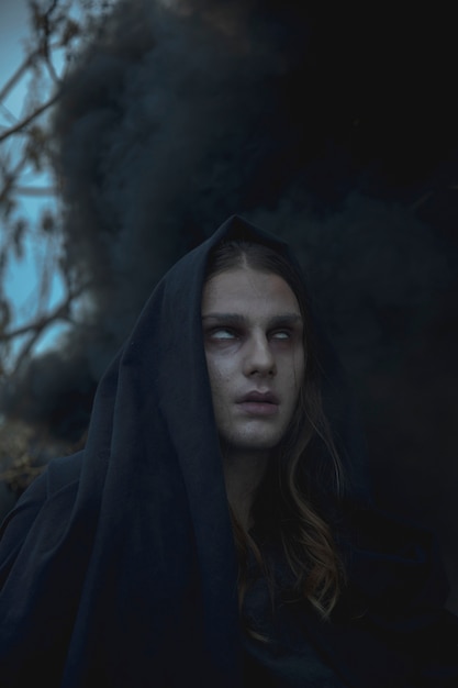 Free Photo close-up portrait of man in black fog