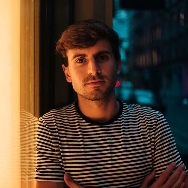 Close-up portrait of man looking at camera outdoors