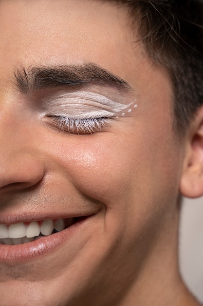 Close up portrait of person wearing make up liner