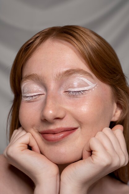 Close up portrait of person wearing make up liner