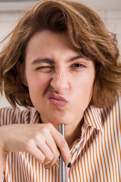 Free Photo close up portrait of a pretty young woman winking