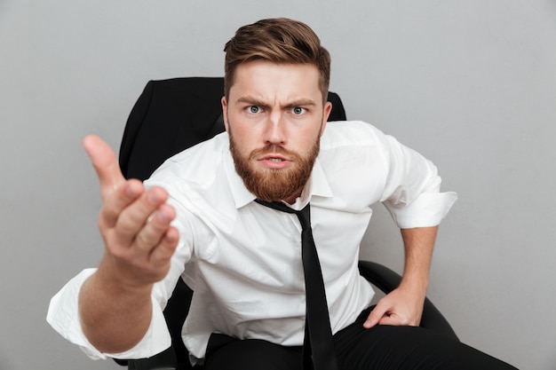 Free photo close up portrait of a unsatisfied man in white shirt