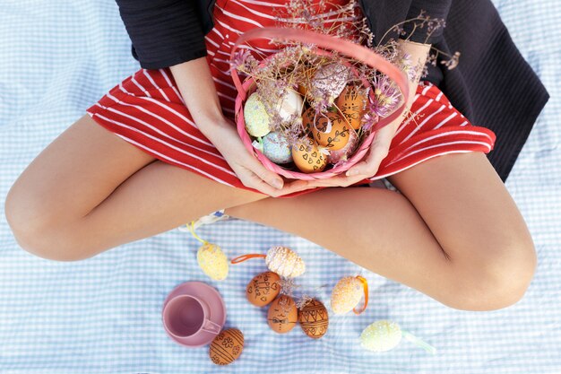 Close up portrait of woman holding easter basket