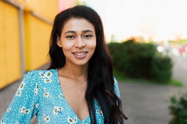 Close-up portrait of woman smiling at camera