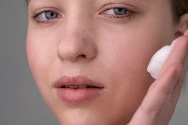 Close up portrait of woman with hydrated skin