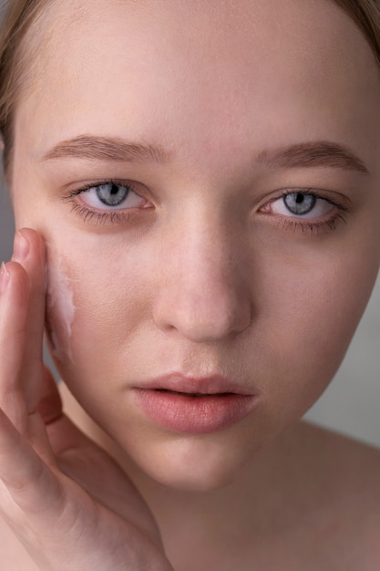 Free Photo close up portrait of woman with hydrated skin