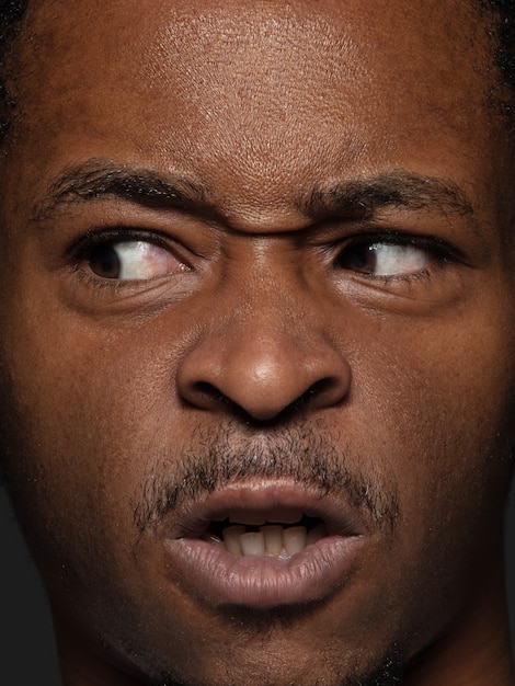 Free photo close up portrait of young and emotional african-american man