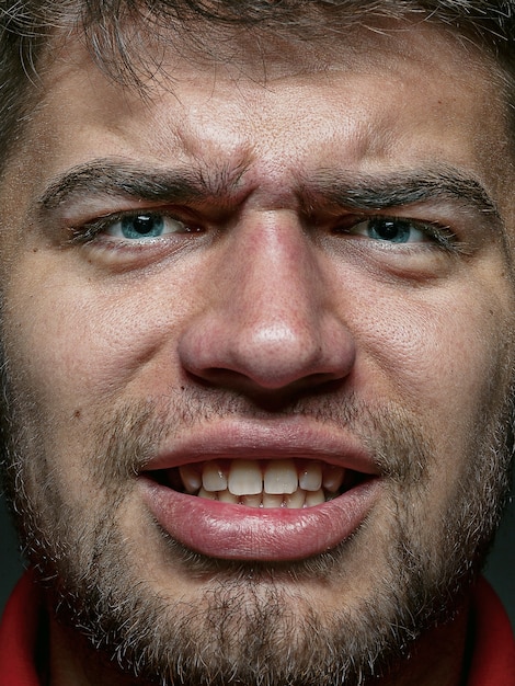 Free photo close up portrait of young and emotional caucasian man