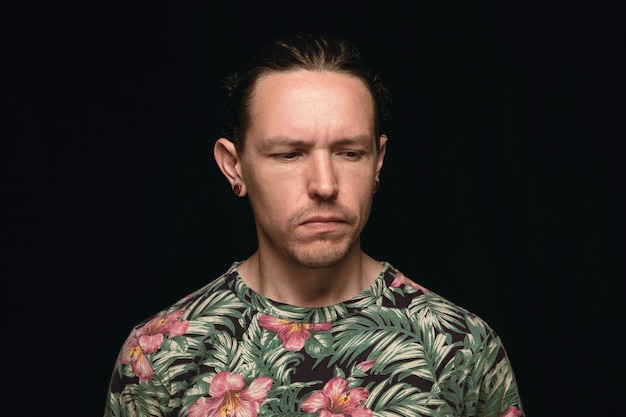 Free photo close up portrait of young man isolated on black studio